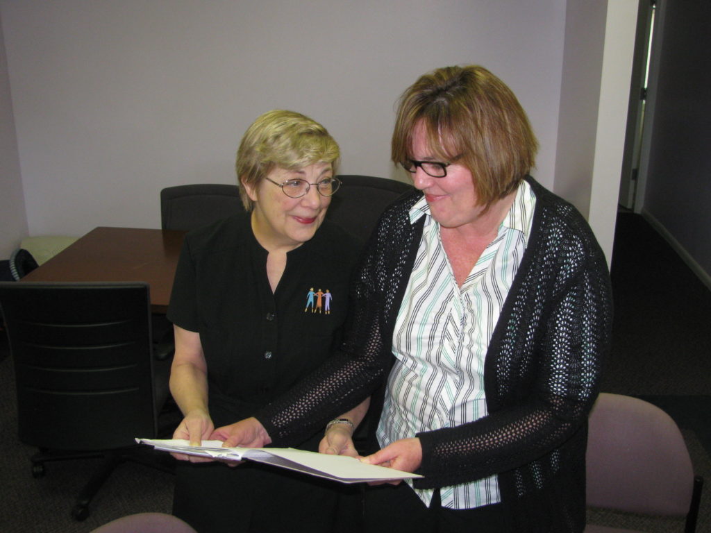 An ESC volunteer and a nonprofit employee working together